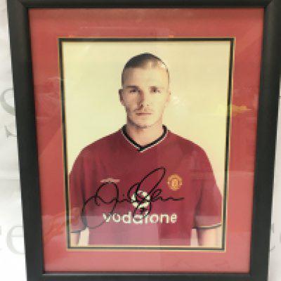 A framed and signed David Beckham print including certificate of authenticity. Postage category B