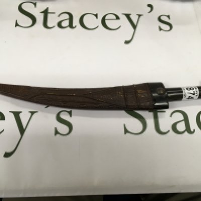 An African style Kursk with a horn handle and a leather patterned scabbard.