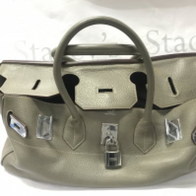 A leather Hermes bag. Postage category C