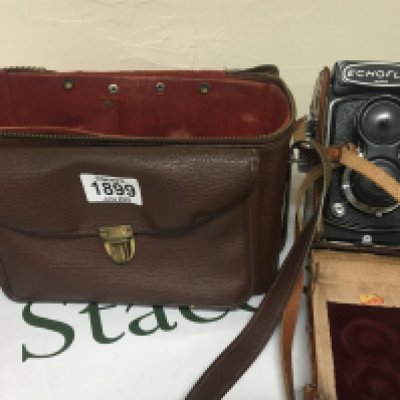 An Echoflex camera serial number 6988 in a fitted case and with camera case and a few accessories.