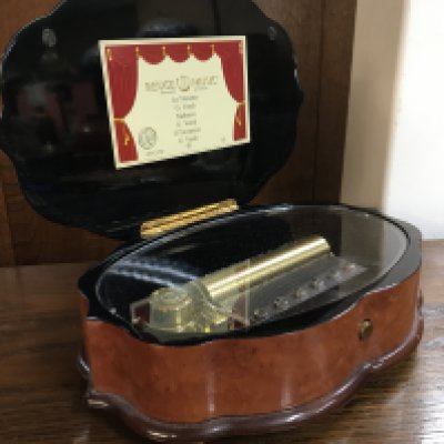 A Swiss Reuge Music box , seen working . 26cm wide, postage category B