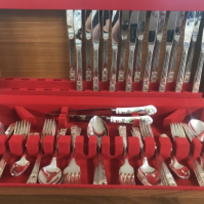 A community cutlery set together with two Aynsley knives and cased knives and spoons.