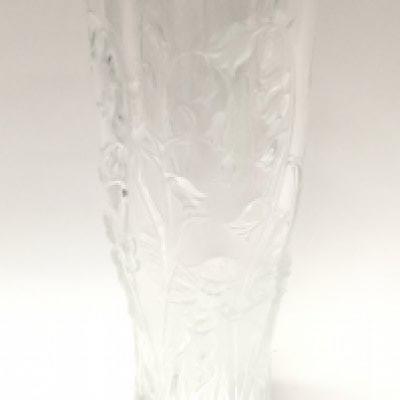 A Lalique glass vase decorated with Putto and flowers. 19.5cm tall. This lot cannot be poted