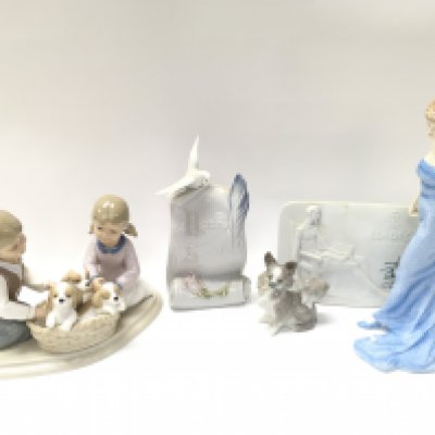 A Collection of porcelain figures including Royal Doulton Diana figure, Lladro dog figure, Leonardo collection figure group, Lladro society scroll and plaque. Some boxed. This lot cannot be posted. NO RESERVE