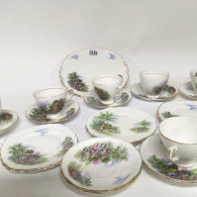 An English bone china tea set decorated with country cottages Royal Vale six place setting with serving plate no obvious damage. NO RESERVE