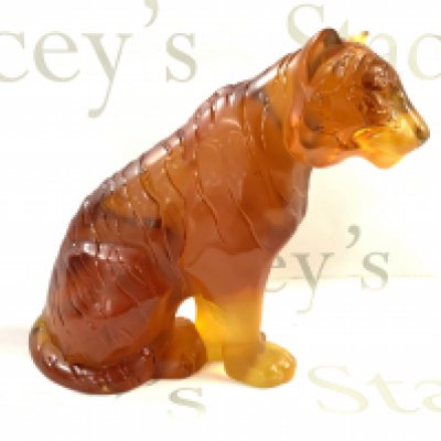 A large Lalique Amber glass tiger, 20th century, seated, overall decorated with black stripes, height 24.5cm. (D)