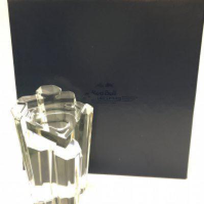 A boxed Red Bull racing glass Superman Returns premier paperweight , 14cm tall. Postage cat C