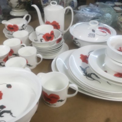 A Susie cooper for Wedgwood tea dinner service decorated in the corn poppy Design.