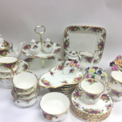 A Royal Albert old country rose tea set including plates, cups, cake stand, porcelain flowers etc. this lot cannot be posted