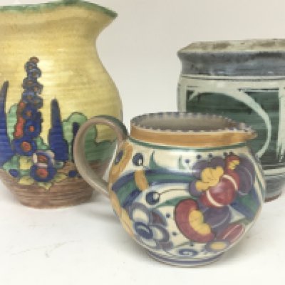 A hand painted Crown Devon jug a Poole pottery jug and a contemporary ceramic vase with marks to the base. (3)