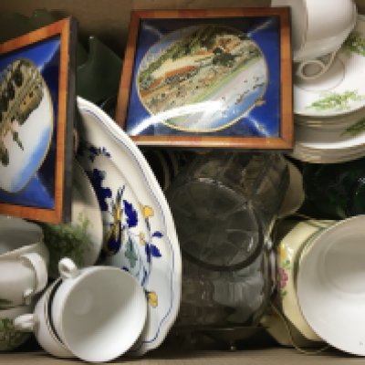 A box containing decorative china and other ceramics.