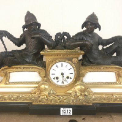 A late 19th century French mantel clock maker LeRoy Paris the gilt metal a d marble vase surmounted with figures of soldiers in armour the movement silk suspension striking on a bell and with makers stamp and numbered 471. With pendulum not seen working. 60cm wide 40cm high