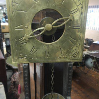 A Chinese brass water clock the dial with Roman numerals.