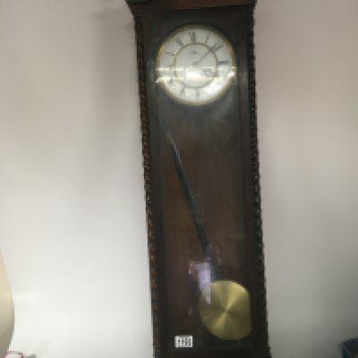 A Vienna style wall clock with an enamel dial visible pendulum and single brass weight. Height 107cm. NO RESERVE