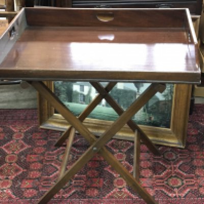 A 19th century Mahogany butlers tray with folding stand height 77cm length 76cm