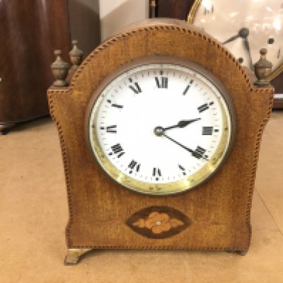A small Edwardian mantle clock. 18cm tall by 14cm wide.