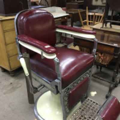 A Quality and rare Vintage 1930s Professional American barbers chair with a deep red upholstery and chrome frame fully adjustable. maker Emile J.Paidar Company Chicago
