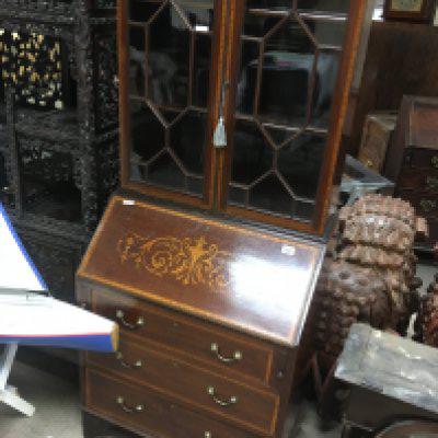 A Edwardian mahogany inlaid bureau bookcase with a pair of glazed doors above a fall front with three drawers under.