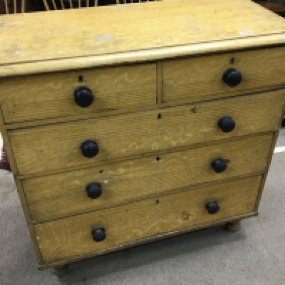 A late Victorian pine chest of drawers fitted with two short and three long drawers.