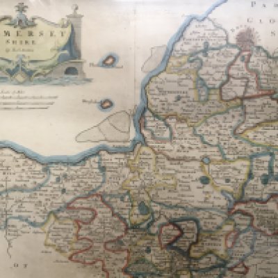 A framed Antique map of Somerset Shire by Rob Morden and two framed late 19th century watercolour study of flowers and a rural scene with a figure in a shallow river (3). NO RESERVE