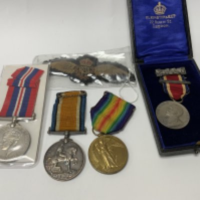 A small group of British WW1 and WW2 medals etc. (A)