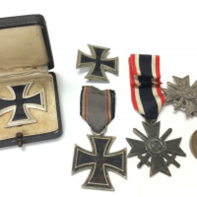 A collection of WW2 German iron cross medals, war merit medals. Postage category B