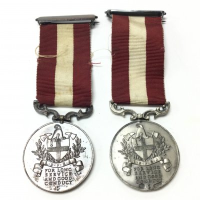 Two London fire brigade long service and good conduct medals, one sterling silver and one bronze. postage category A