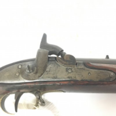 An Early 19th Century Percussion muzzle load East India Company rifle possible a flint lock conversion full length walnut stock brass trigger and fittings guard the action stamped with lion and 2 believed to be a pattern A circa 1840.