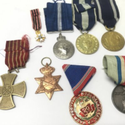 A Collection of European war medals including Hungarian, Portugal war cross, French Alliance Francaise medal, Greek commemorative medal, Polish medals etc. postage category B
