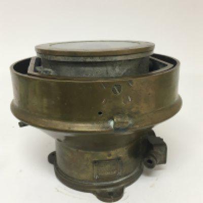 A Military gun metal or brass cased ships compass patt 0919 and numbered 1355 H. Diameter 24cm approximately.