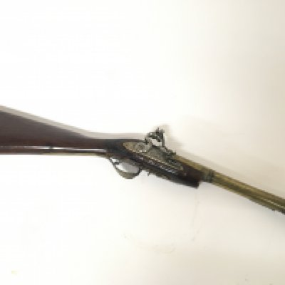 An 18th century flintlock Blunderbuss with a brass barrel with proof marks and inscribed Cornhill London. brass trigger guard. Some later alterations. length 69cm