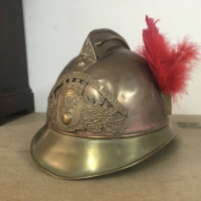 A 19th century French brass firemans helmet with removable parade plume