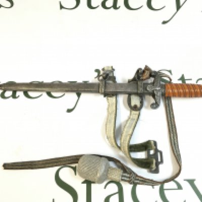 A WW2 Third Reich Luftwaffe dagger, second pattern. Marked Alcosco Solingen. Engraved Lt Baums on the hand guard. 40cm long in total, blade approximately 26cm long. This lot cannot be posted