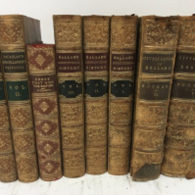 A collection of leather bound books Civilisation in England by Henry Thomas Buckle second edition 1864 Hallams Constitutional History and Macaulays Miscellaneous writings deeds that won the Empire (8)