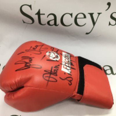 A multi signed boxing glove. Names comprising Sir Henry Cooper, John H Stracey and Alan Minter. Shipping category B.