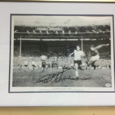 A framed and glazed Geoff Hurst signed print with COA, approx 70cm x 55cm. Shipping category D.