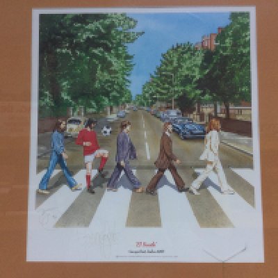 A framed and glazed signed limited edition print titled 'El Beatle' and signed by George Best, numbered 141/150. Comes with COA. Approx 73cm x 58cm.