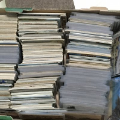 Three boxes containing vintage British post cards some in albums (3)