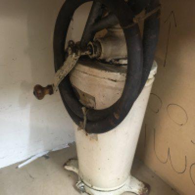 A vintage motorcycle oil forecourt pump