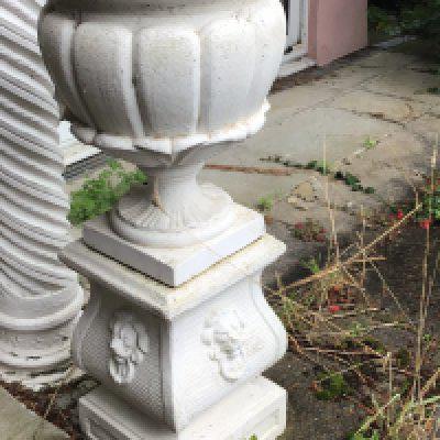 A composition garden urn and stand of classical influences with stylised acanthus leaves the base with raised lion masks good Condition and with makers stamp height 109cm sold in situ buyer to collect. NO RESERVE