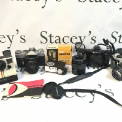 A Collection of vintage cameras Polaroid Land Camera, Zenit-E, Minolta Dynax 7000i, Pentax. Postage category C