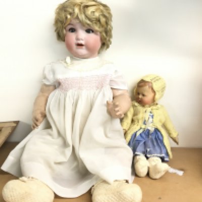 A large early 20th century doll with bisque head and composition body and one other doll. Postage D