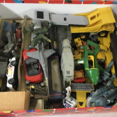 A collection of Playworn toys. Including miniature toy cars and other vehicles and a boxed helicopter.
