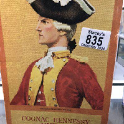 A bottle of cognac Hennessy Extra .