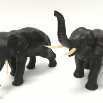 A pair of Japanese small bronze elephant figures ,one marked at the base. Approx 8cm tall. Postage category B