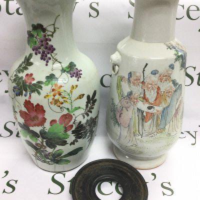 Two Oriental vases, one decorated with elders, the other with foliage and both with script to the reverse, approx heights 43cm and 425cm. Shipping category D.