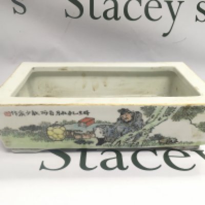 A Chinese rectangular planter with hand painted decoration of figures in a landscape setting with Oriental script, approx length 28cm. Shipping category D.