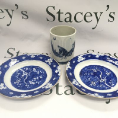 A blue and white brush pot and two dishes decorated with prunus blossom, approx diameter 23cm. Shipping category D.