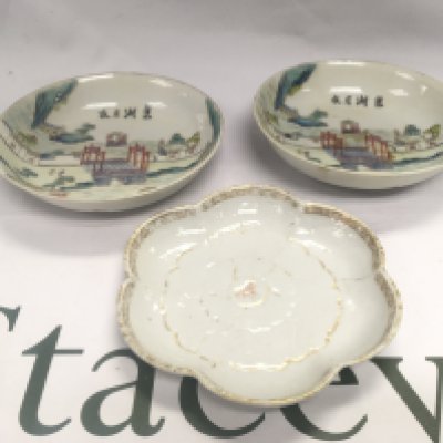 Three Oriental dishes comprising a pair depicting a landscape scene with buildings and a river, approx diameter 14cm plus one other with worn decoration (3). Shipping category D.