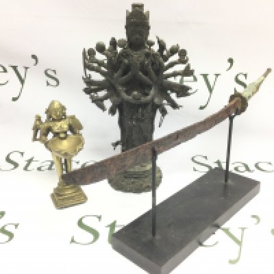 A bronze figure of a deity plus one other and an antique knife on stand (3). Shipping category D.